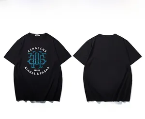 Detail view of cotton black crew neck t-shirt featuring blue geometric graphic and white text