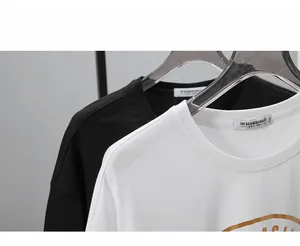 Detail view of cotton t-shirt necklines with high-quality 1991 woven label stitching