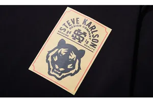 Detailed close-up of tiger head graphic print on black street style cotton t-shirt