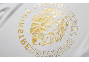 Macro detail of golden geometric lion head print on white cotton t-shirt fabric