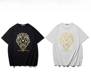 Detailed close-up of lion head gold foil prints on black and white cotton T-shirts