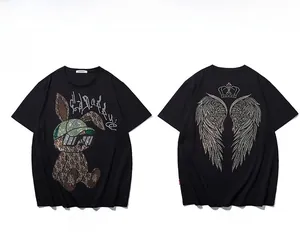 Detail of street style black T-shirt with rhinestone rabbit and angel wing crown design