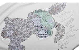 Detailed view of white cotton T-shirt featuring a green bear with sparkling rhinestones