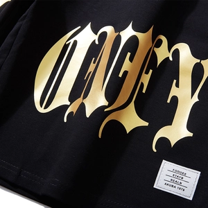 Men's loose black street style shorts featuring premium gold gothic lettering and brand label