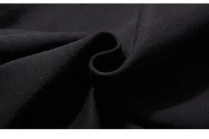 Macro view of high-density black knitted cotton fabric texture for sports pants