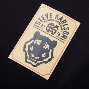 Oversized black cotton T-shirt featuring a tiger graphic and vintage letter print