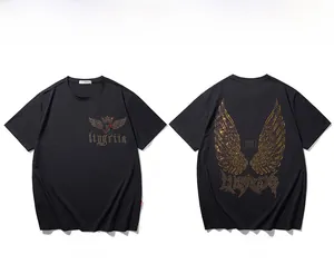 Front and back views of a black T-shirt featuring metallic gold wings and crown emblems