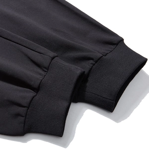 Black joggers with ribbed elastic cuffs and premium cotton blend fabric details