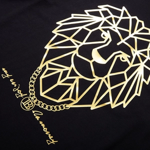 Men's oversized black T-shirt with golden geometric lion head print and metallic foil text