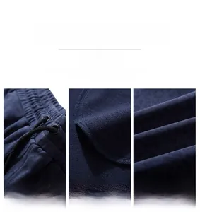 Detail of navy blue knit fabric with subtle leopard pattern and drawstring waistband