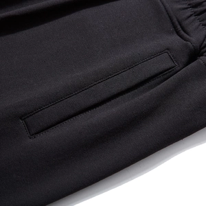 Men's loose sports pants with elastic waistband and side pocket detail in black cotton