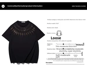 Detail view of black oversized cotton T-shirt with golden rhinestone lightning neckline