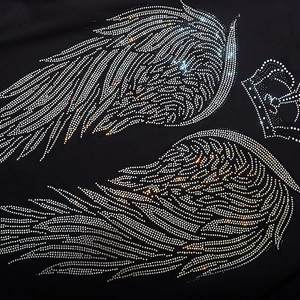 Oversized black T-shirt featuring luxury rhinestone crown and silver wing pattern