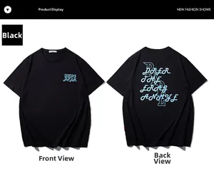 Vues avant et arrière du t-shirt noir oversize en coton avec imprimé artistique bleu