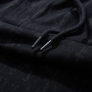 Men's loose black casual shorts with drawstring detail and vintage washed texture