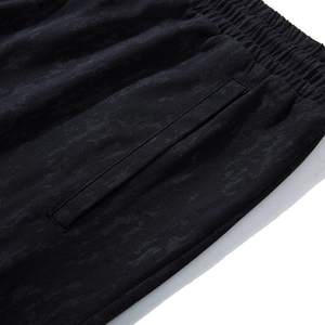 Loose fit black men's shorts with elastic waistband and side pockets in textured fabric