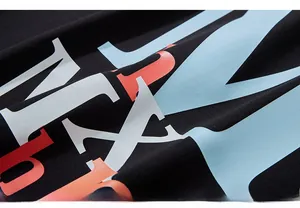 Close-up of high-quality black knit fabric with vibrant multi-color puff print lettering