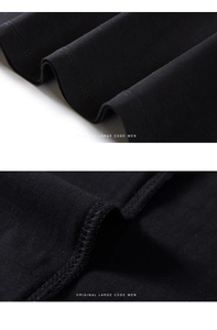 Makroaufnahme von hochwertigem schwarzem Baumwollstoff mit verstärkten Nähten am Herren-T-Shirt