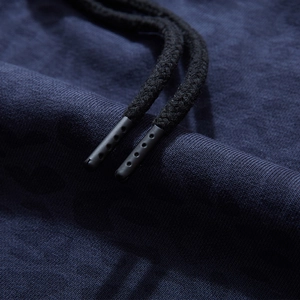 Navy knit shorts with black braided drawstring and matte textured plastic aglet detail