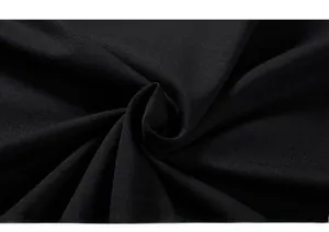 Macro texture of soft black cotton knitted fabric showing premium drape and weave quality