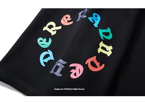 Close-up of colorful circular letter print on black cotton athletic shorts