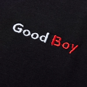 Oversized black cotton T-shirt featuring detailed Good Boy embroidery on the front