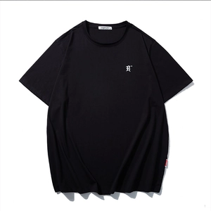 Minimalist black cotton T-shirt featuring a white embroidered letter R on the chest