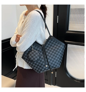 Detail of checkered tote bag with matching round coin pouch on model shoulder