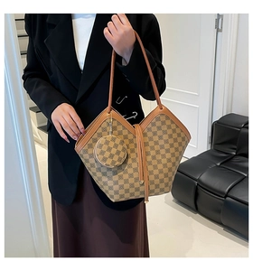 Brown checkered tote bag with matching round mini coin purse charm and long handles