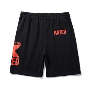 Men's loose black street-style athletic shorts with red graphic print on a white background