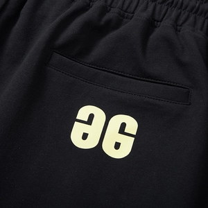 Men's loose black cotton sweat shorts with drawstring waist and logo print detail