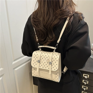 Chic cream polka dot backpack for women featuring trendy tidal dryness typography