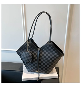 Detail of grey checkered tote bag with matching mini round pouch and V-cut side design