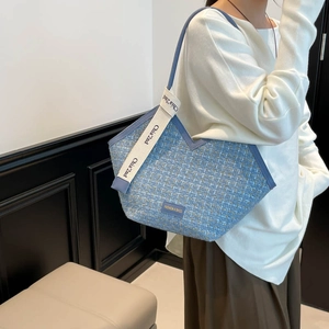 Chic blue and yellow tweed tote bag with stylish V-shaped opening and white strap