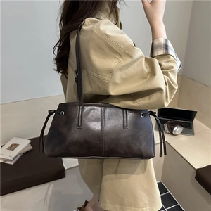 Retro coffee brown oil wax leather tote bag shown on model in a casual lifestyle setting