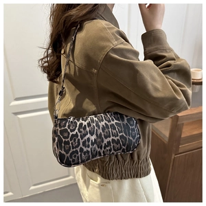Retro leopard print underarm bag shown as a shoulder accessory with a stylish look