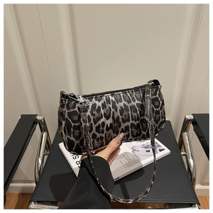 Close-up of leopard print underarm bag with a vintage design and sleek silver zipper