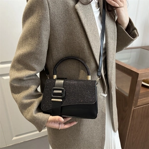 Chic black sequined flap handbag for women with a silver shimmer and square buckle