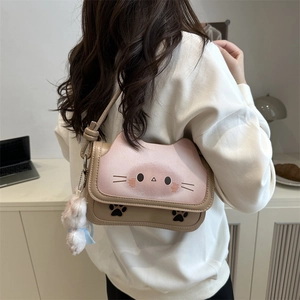 Cute pink and beige cat-shaped shoulder bag with plush bunny charm for women