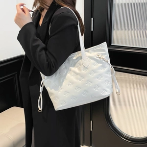 Minimalist white tote bag with 3D bow texture embossing and side drawstring detail