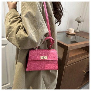 Hot pink square crossbody bag featuring woven texture and gold twist lock detail