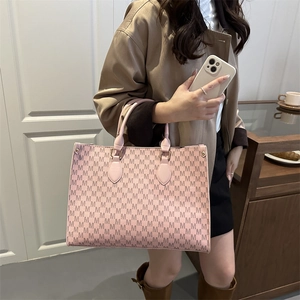 Pink tote bag for women with M letter print and double top handles for daily fashion