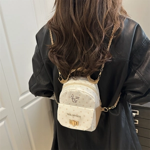 Polka dot canvas mini backpack with cat illustration and gold-tone chain straps