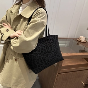 Chic black leopard print tote bag for women with velvet texture and long shoulder straps