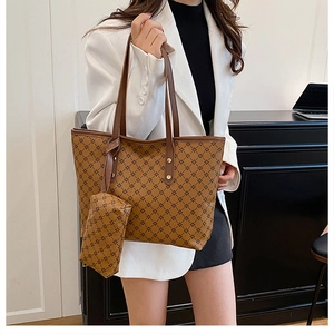 Brown tote bag with geometric star pattern and matching coin purse on a model