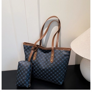Detail of jacquard tote bag with leather trim, metal studs and matching clutch purse