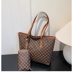 Detail of trendy tote bag set with matching zipper pouch and classic pattern