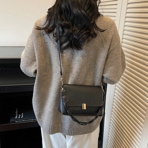 Minimalist black PU leather crossbody bag with gold buckle and woven strap for women