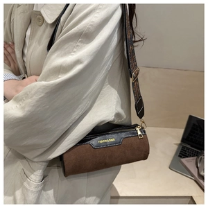 Retro cylinder crossbody bag with bohemian strap and brown frosted texture detail