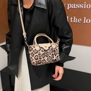 Fashion leopard print crossbody bag with beige leather trim and silver metal buckle